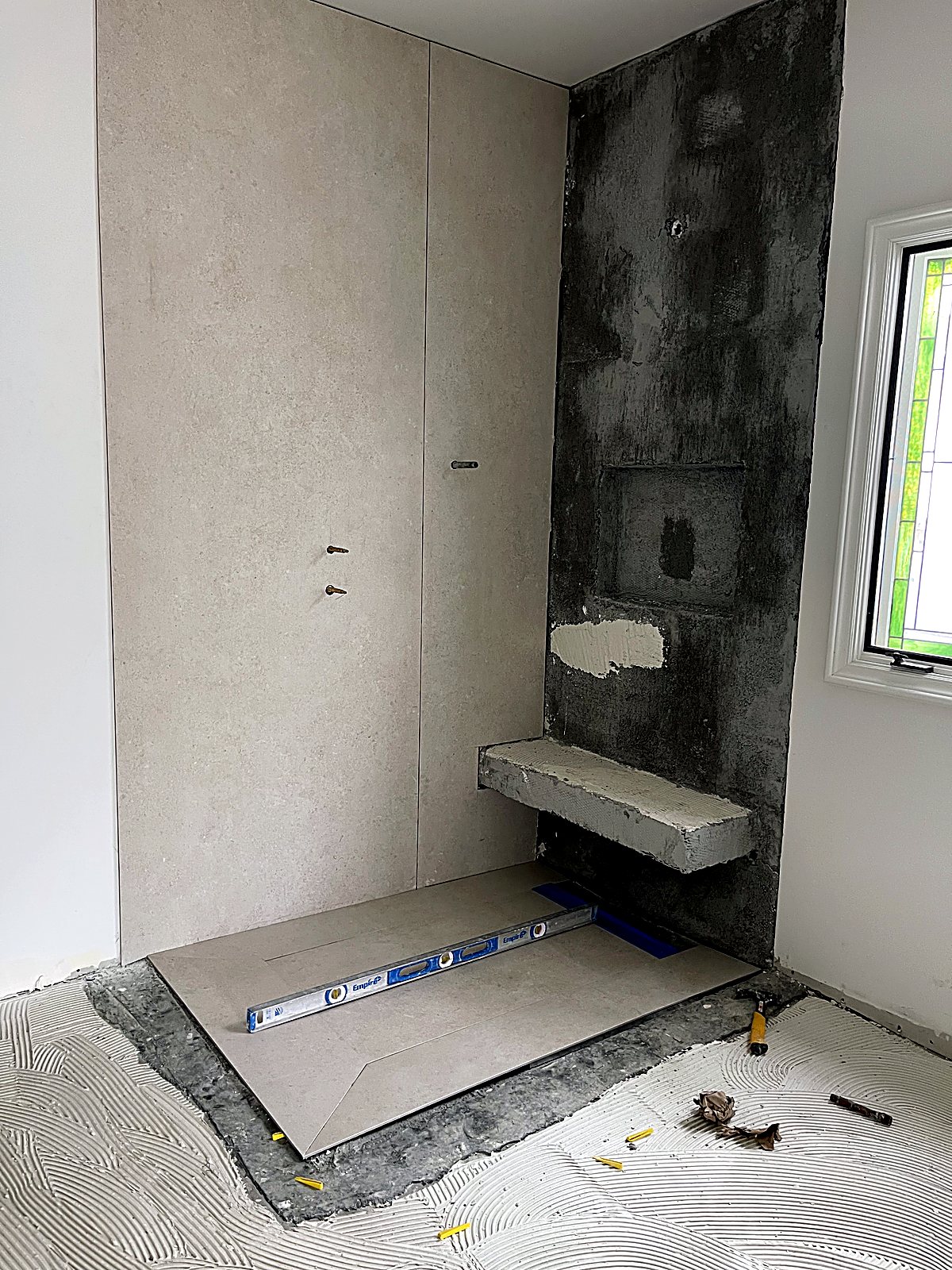 Large-format tile slab installation in the new shower