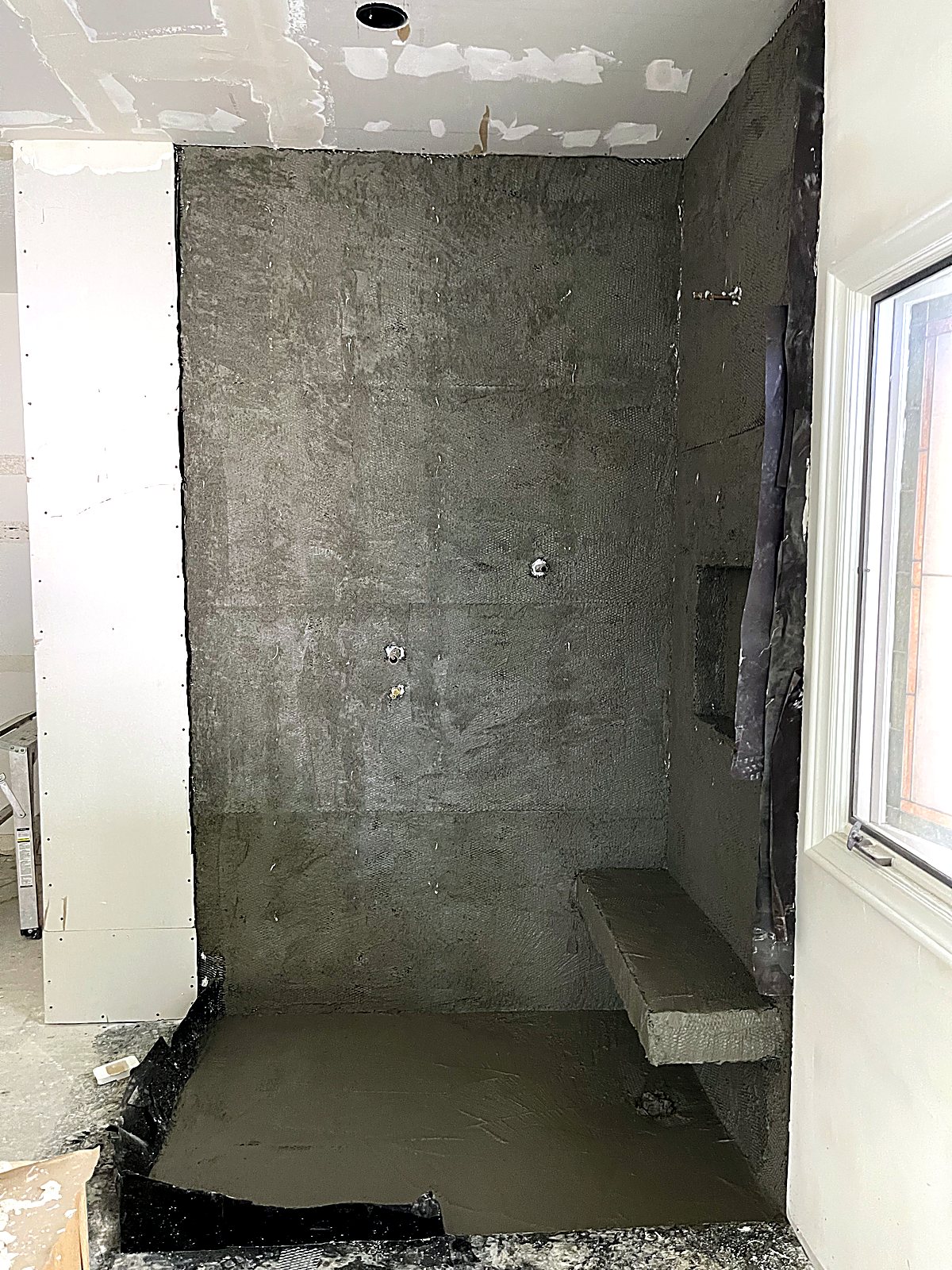 Mortar and waterproofing work on the new shower at Little Oak Lane